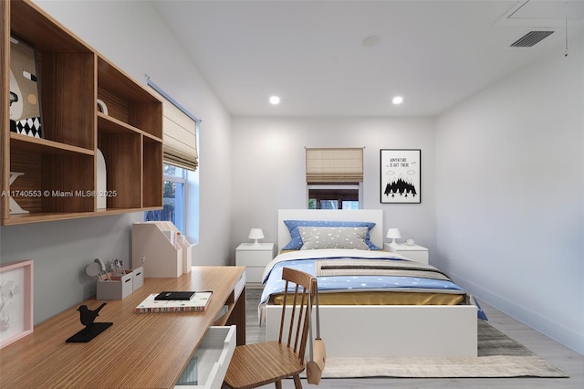 bedroom with light hardwood / wood-style flooring