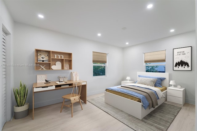 bedroom with light hardwood / wood-style flooring