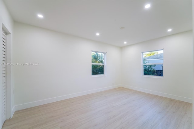 spare room with light hardwood / wood-style floors