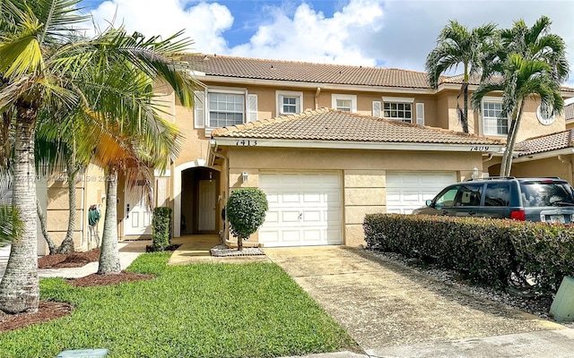 view of front of property with a garage