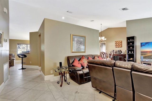 tiled living room with lofted ceiling and a notable chandelier