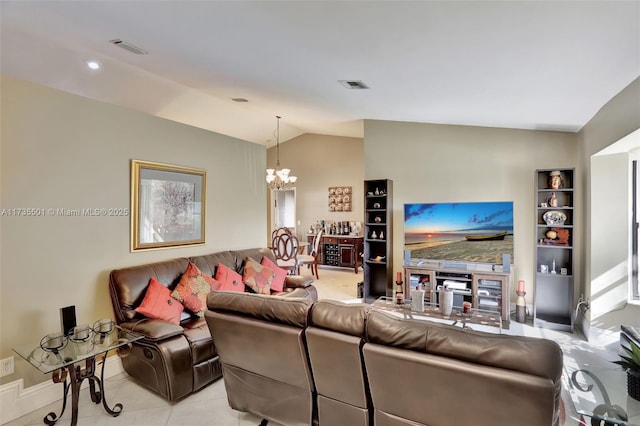 living room with an inviting chandelier, lofted ceiling, and light tile patterned floors