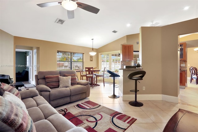 tiled living room featuring vaulted ceiling and ceiling fan