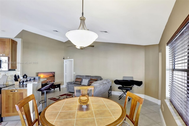 dining room featuring light tile patterned flooring