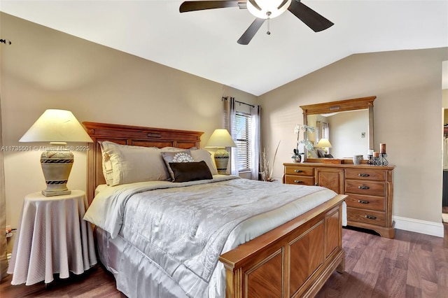 bedroom with lofted ceiling, dark hardwood / wood-style floors, and ceiling fan