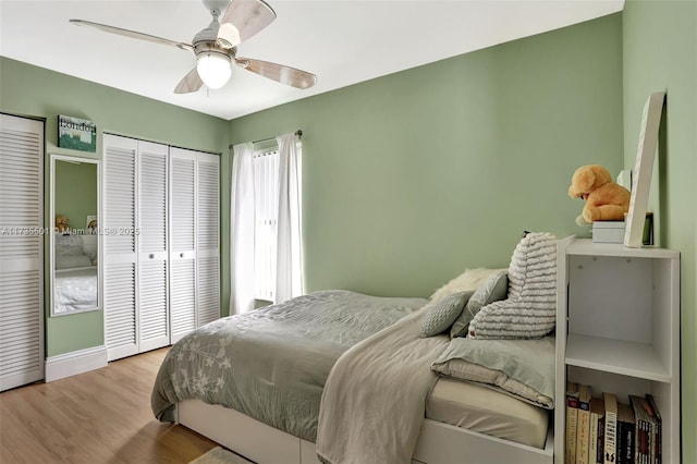 bedroom featuring light hardwood / wood-style flooring and ceiling fan