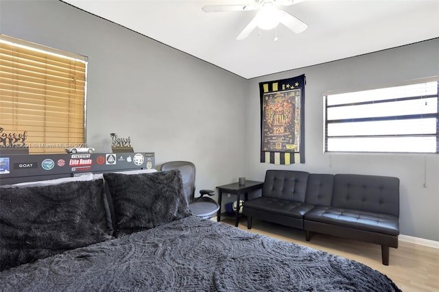 living room with hardwood / wood-style flooring and ceiling fan