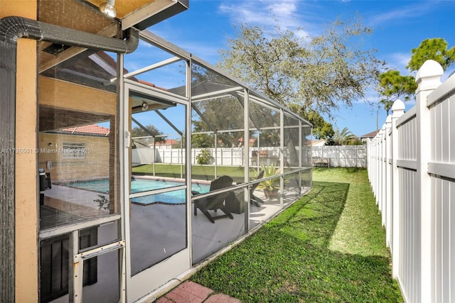 view of pool with a lanai and a lawn