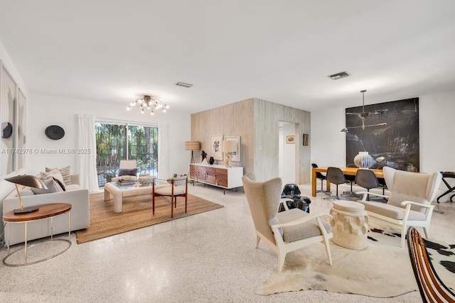 living room with an inviting chandelier