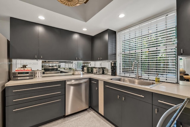 kitchen featuring stainless steel dishwasher, a healthy amount of sunlight, and sink