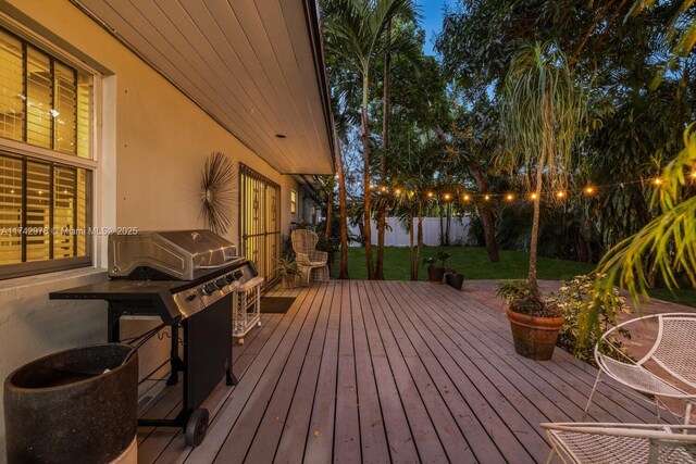 wooden terrace with area for grilling