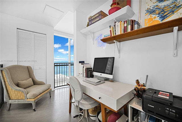 home office featuring concrete floors