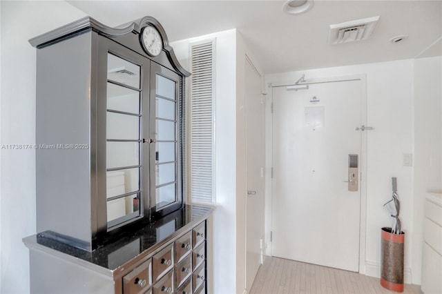 hallway featuring light hardwood / wood-style flooring