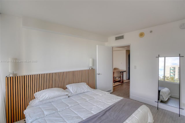 bedroom featuring wood-type flooring