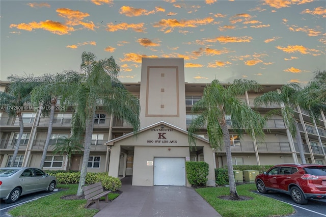 view of outdoor building at dusk