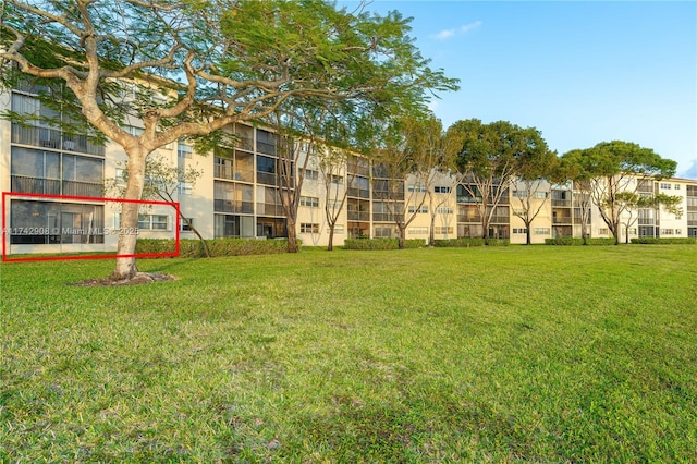 view of home's community with a lawn