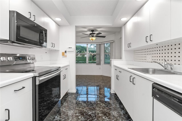 kitchen featuring sink, white cabinetry, white dishwasher, electric stove, and ceiling fan