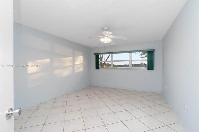 empty room featuring a textured ceiling and ceiling fan