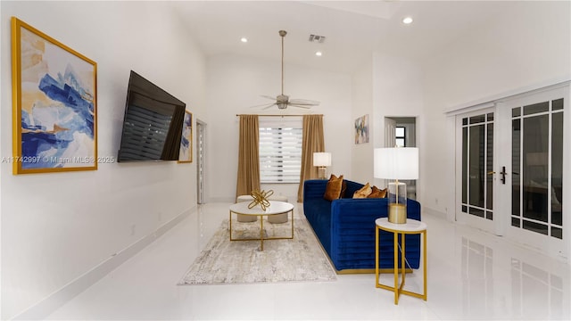 living room with french doors, ceiling fan, and a high ceiling