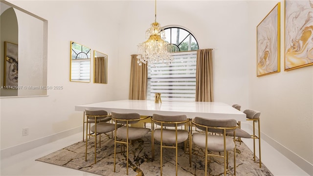 dining space featuring a notable chandelier