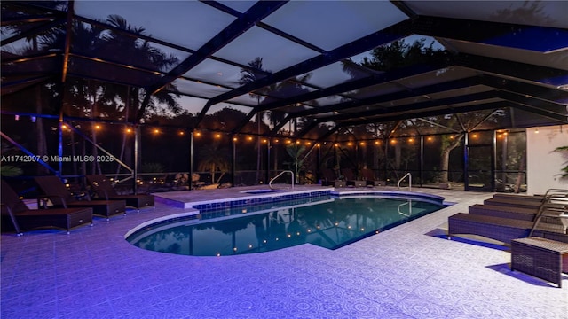 view of pool with a lanai and a patio