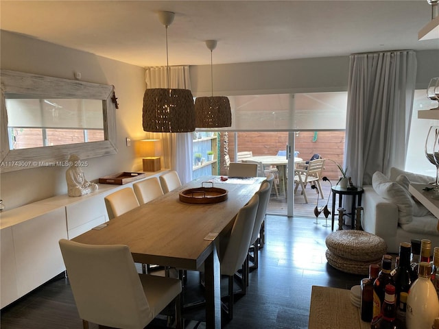 dining area with dark hardwood / wood-style floors