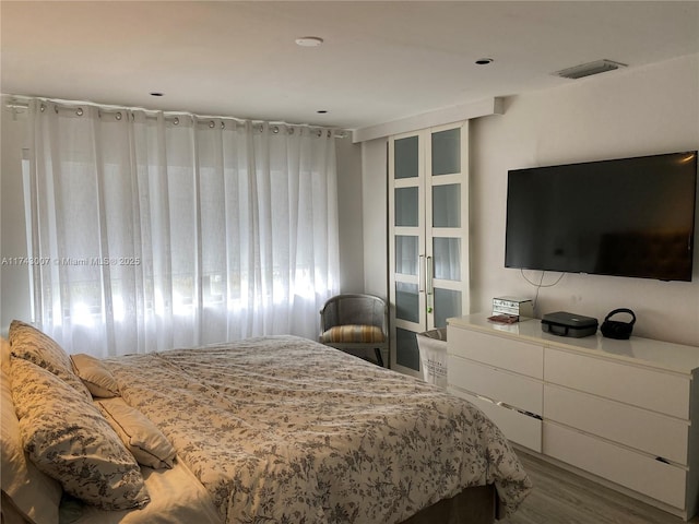 bedroom featuring wood-type flooring