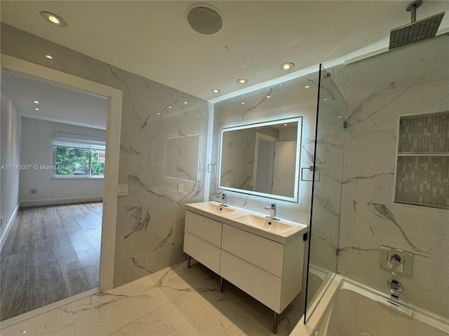 bathroom featuring vanity and a tile shower