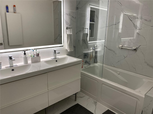 bathroom featuring vanity and tiled shower / bath combo