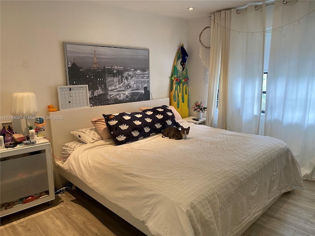 bedroom with light hardwood / wood-style flooring