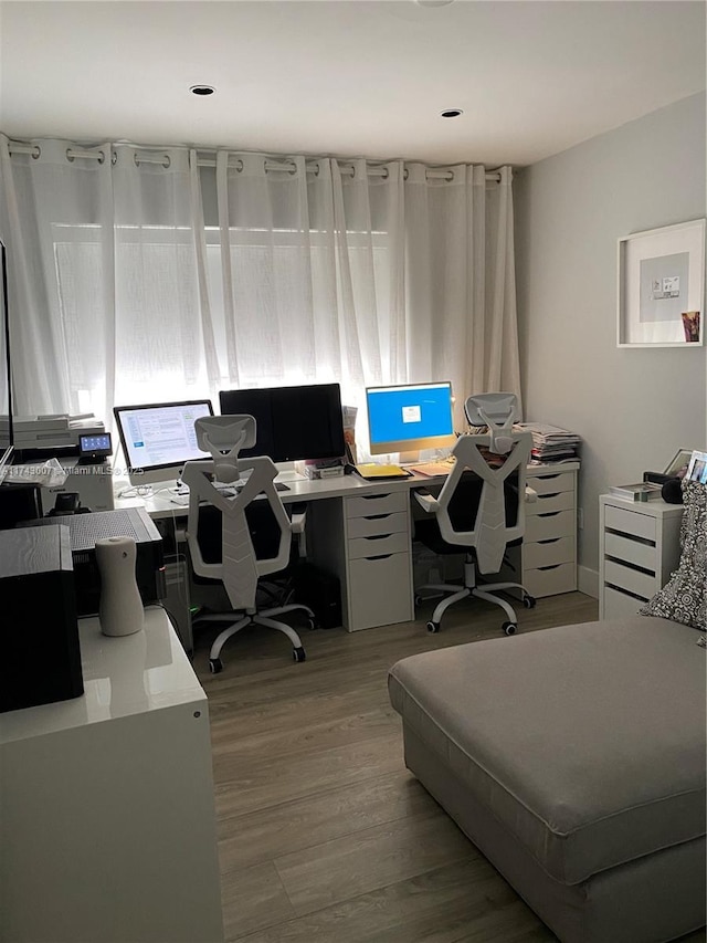 office space with light wood-type flooring