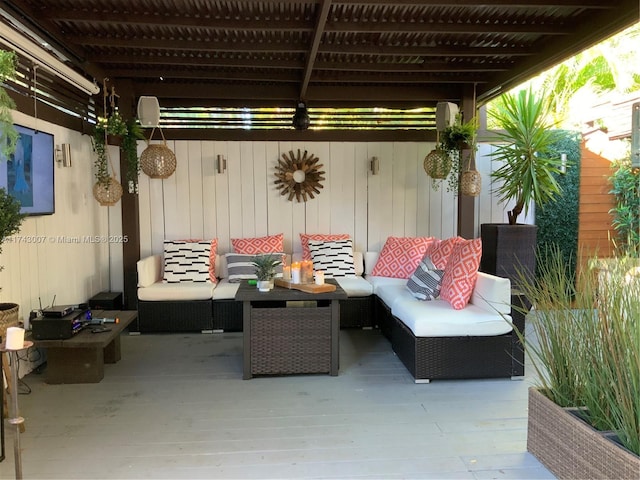 view of patio featuring an outdoor living space and a wooden deck