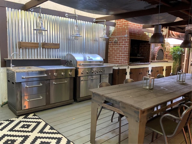 view of patio / terrace with a bar, area for grilling, and a deck