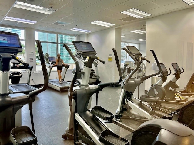 gym featuring a paneled ceiling