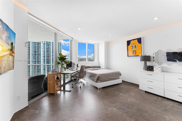 bedroom featuring a wall of windows