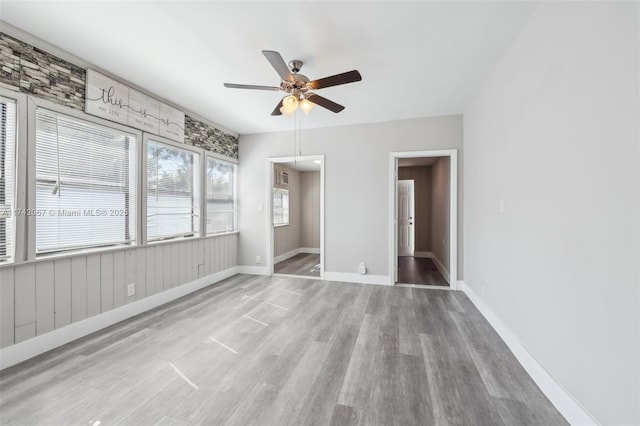 unfurnished bedroom with light hardwood / wood-style floors and ceiling fan