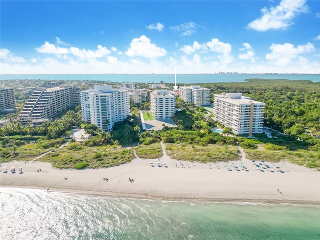 aerial view featuring a water view and a beach view