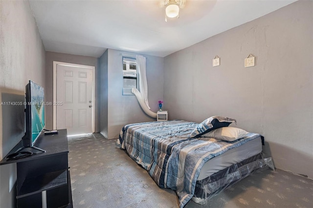 bedroom featuring concrete floors