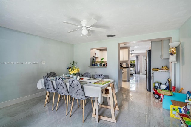 dining room with ceiling fan