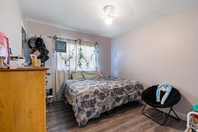 bedroom featuring dark hardwood / wood-style flooring