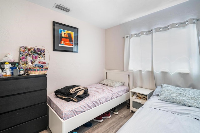 bedroom featuring hardwood / wood-style floors