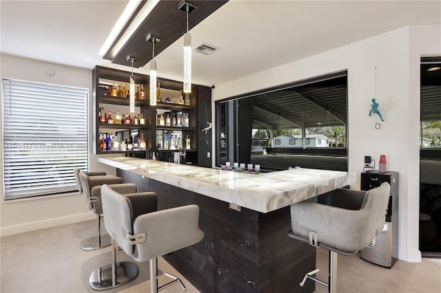 bar featuring decorative light fixtures