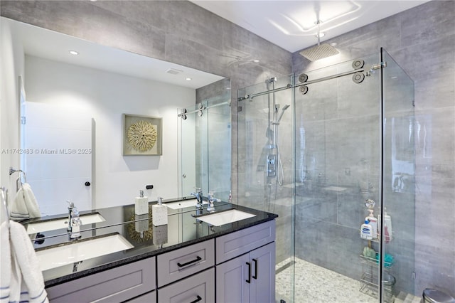 bathroom with vanity and an enclosed shower