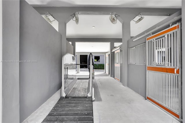 stairs featuring concrete floors