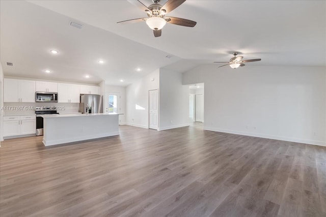 unfurnished living room featuring lofted ceiling, light hardwood / wood-style floors, and ceiling fan