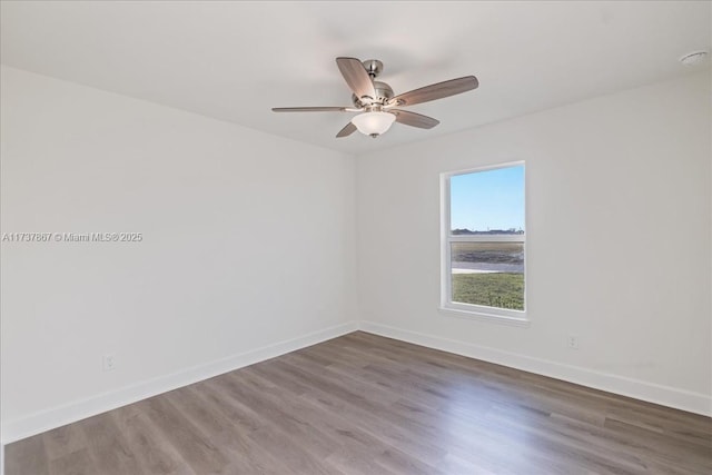 unfurnished room with hardwood / wood-style floors and ceiling fan