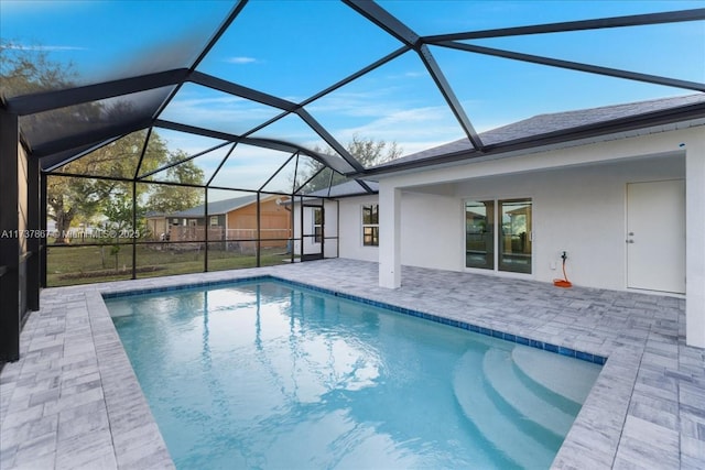 view of pool with a lanai and a patio area