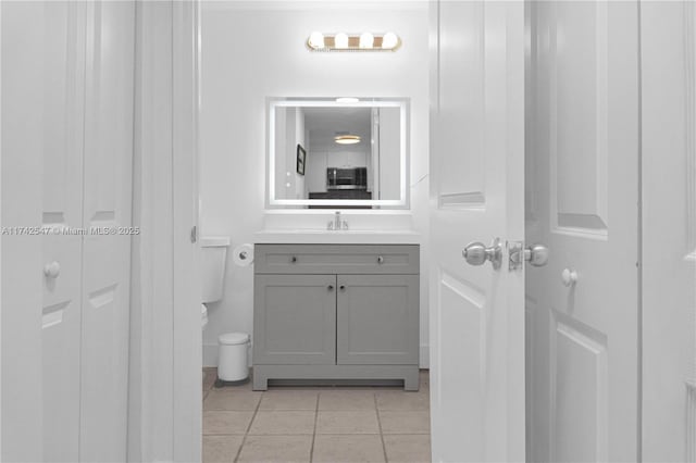 bathroom with tile patterned flooring and vanity