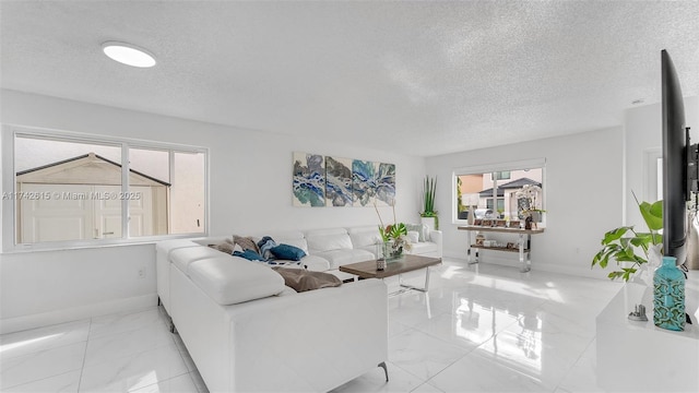 living room featuring a textured ceiling