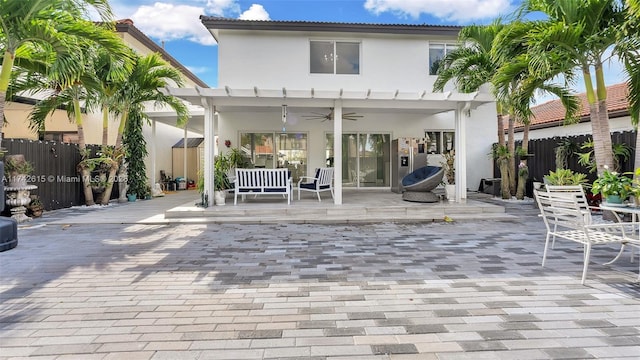 back of house with a patio area, ceiling fan, and a pergola